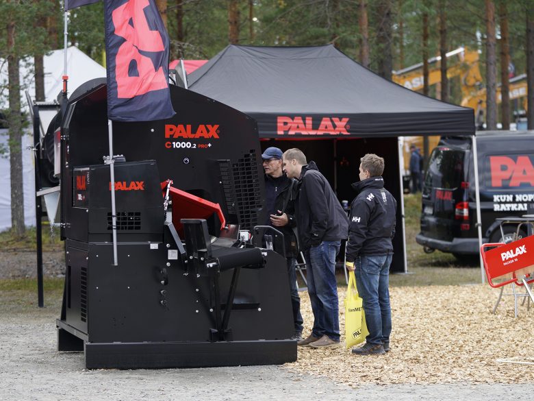 Palax C1000 firewood processor on display at a trade fair.