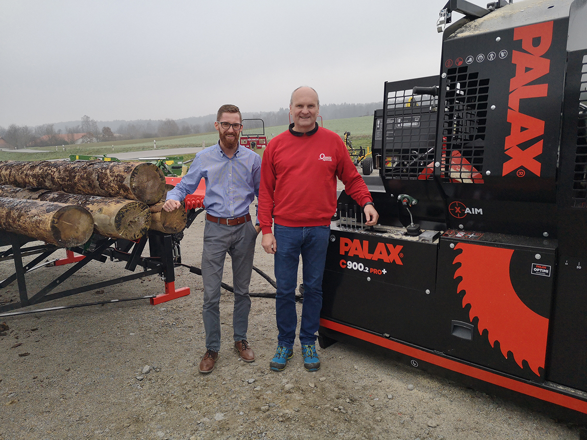 Christian Weber and Peter Oswald next to Palax C900.2 firewood processor.