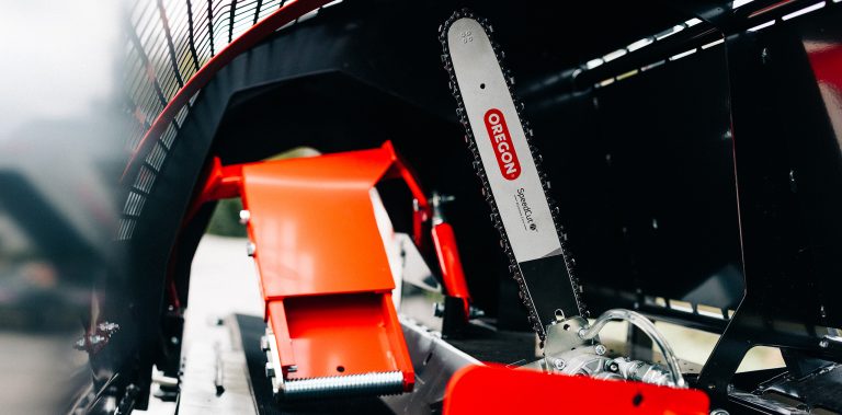 Palax D360 Firewood Processor's chainsaw and log clamp.