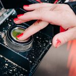 A finger on the Palax X-Aim's touch encoder.